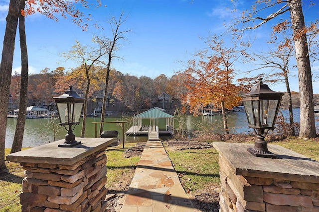 view of yard featuring a gazebo and a water view