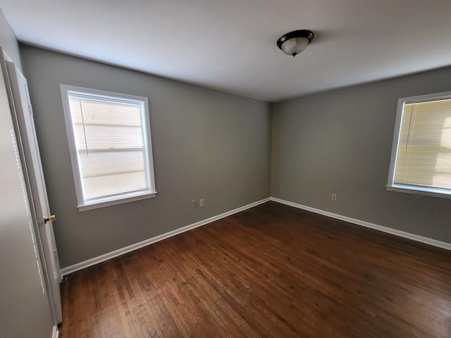 1247 Vistaview Cv, Memphis, TN 38127 - spare room featuring dark wood-type flooring and baseboards