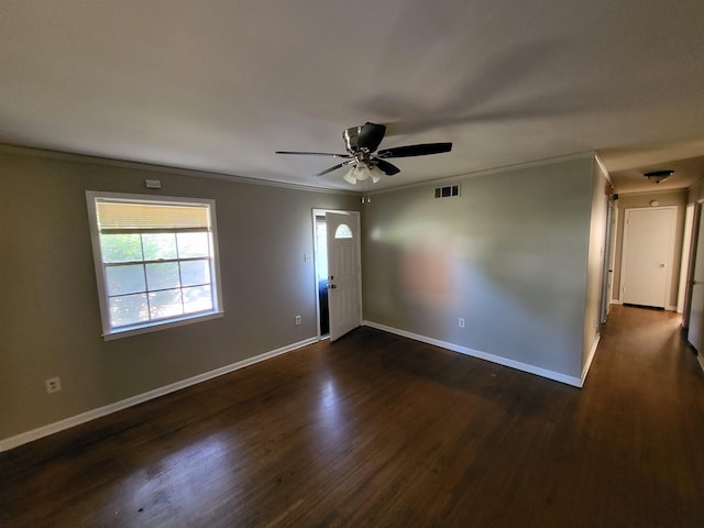 1247 Vistaview Cv, Memphis, TN 38127 - spare room with crown molding, dark wood-style flooring, and ceiling fan