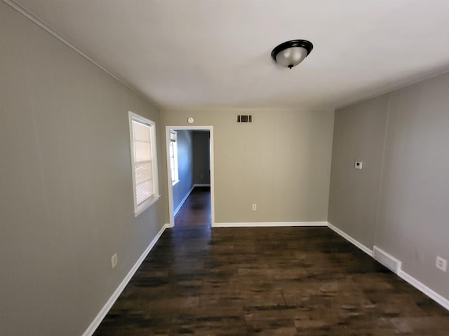 1247 Vistaview Cv, Memphis, TN 38127 - spare room featuring dark wood-style floors and baseboards