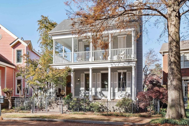 view of front of home featuring a balcony