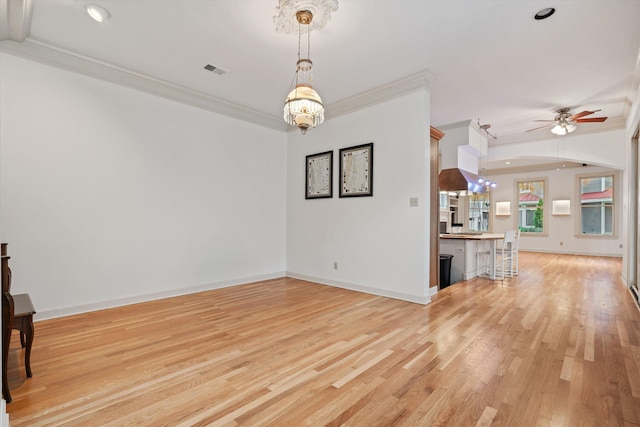 899 Harbor Bend Rd, Memphis, TN 38103 - unfurnished living room with crown molding, ceiling fan, light wood finished floors, a chandelier, and recessed lighting
