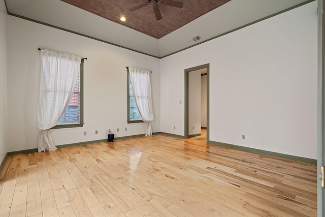 spare room featuring light wood-type flooring and ceiling fan