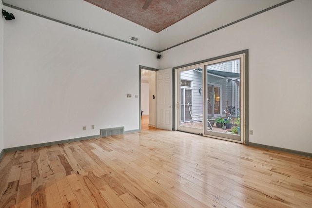 spare room with light hardwood / wood-style floors