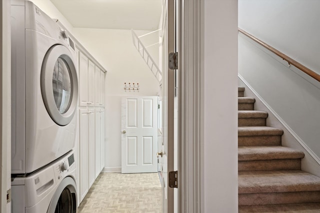 laundry room featuring stacked washer / dryer