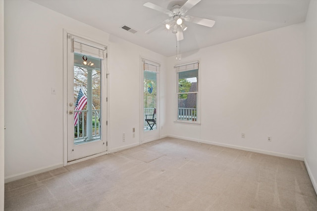 carpeted empty room with ceiling fan