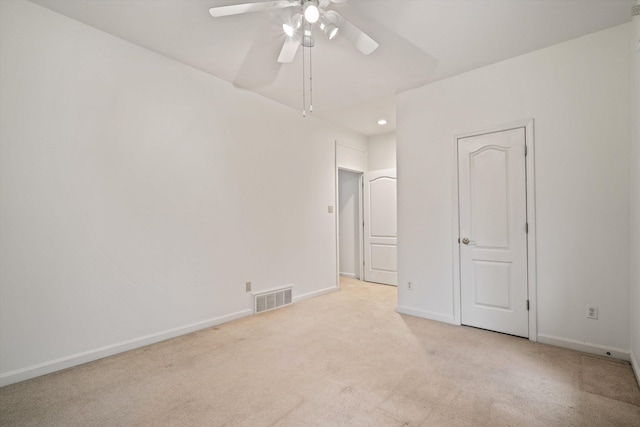 unfurnished bedroom with light carpet and ceiling fan