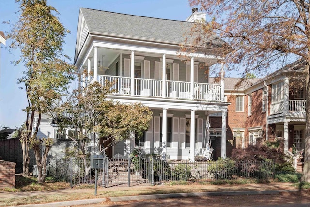 view of front of house with a balcony and covered porch