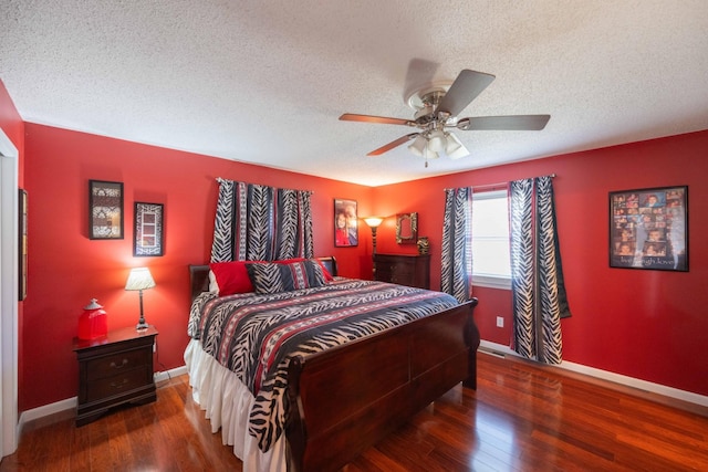 bedroom with a textured ceiling, dark hardwood / wood-style flooring, and ceiling fan