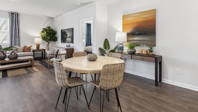 dining space with dark wood-type flooring