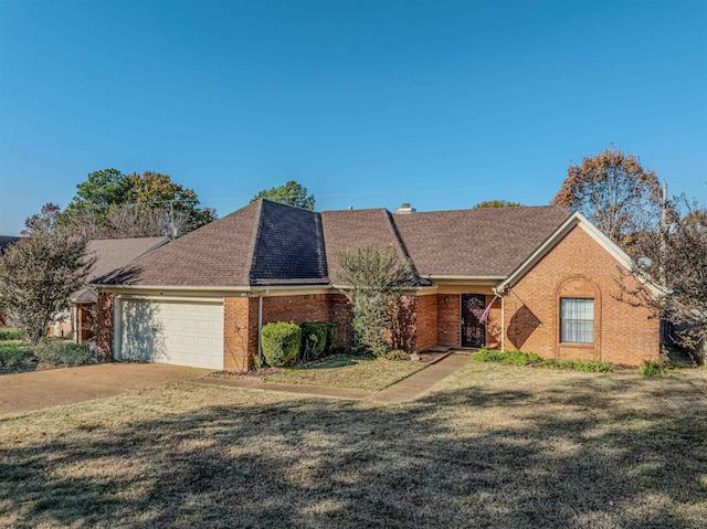 ranch-style home with a garage and a front yard