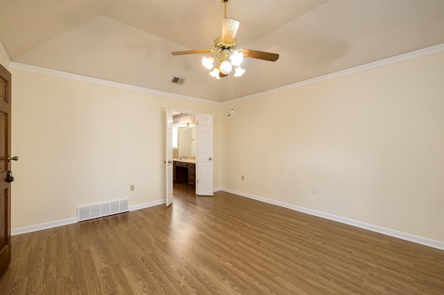 empty room with ornamental molding, dark hardwood / wood-style floors, ceiling fan, and lofted ceiling