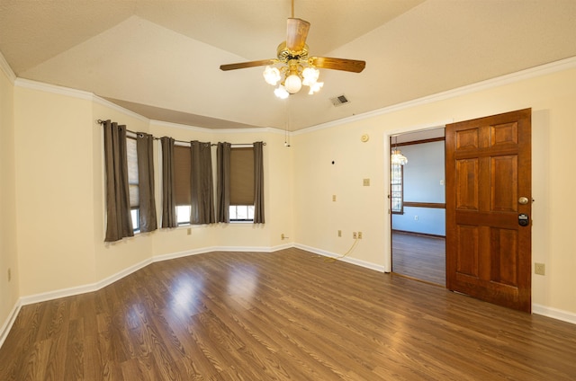 spare room with dark hardwood / wood-style floors, vaulted ceiling, ceiling fan, and ornamental molding