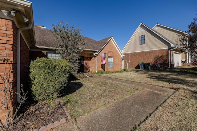 view of front facade with a garage and a front lawn