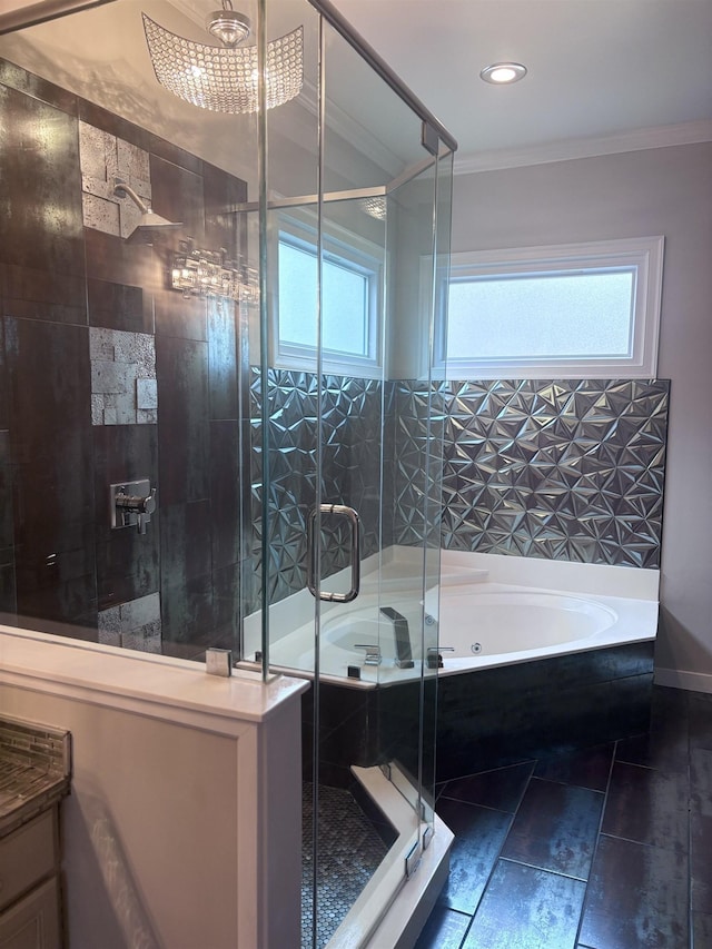 bathroom with independent shower and bath, crown molding, and a healthy amount of sunlight