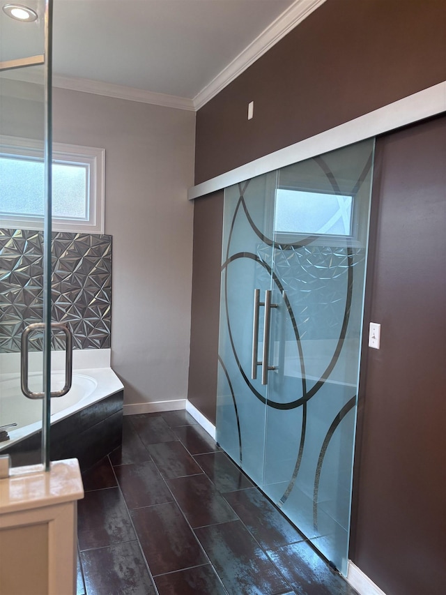 bathroom with a bathtub and ornamental molding