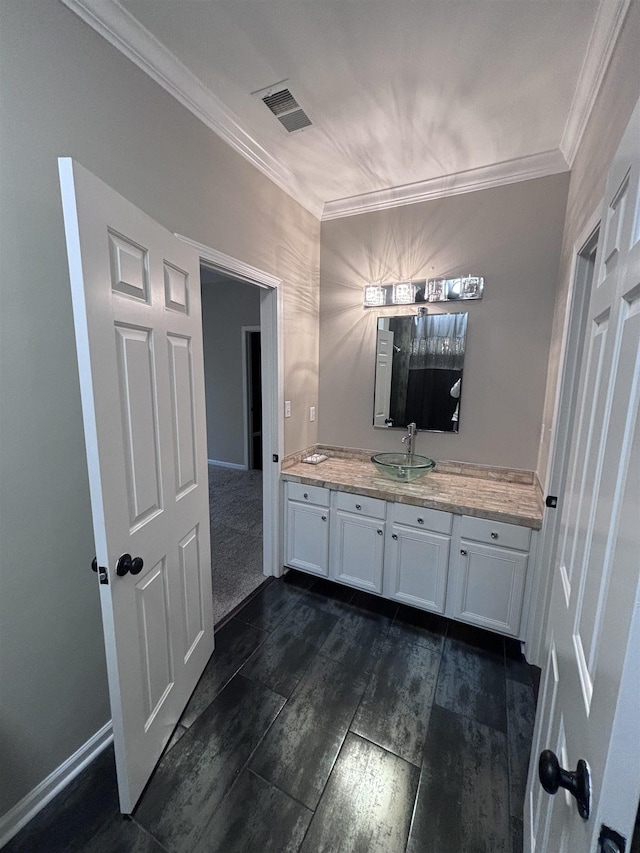 bathroom featuring vanity and crown molding