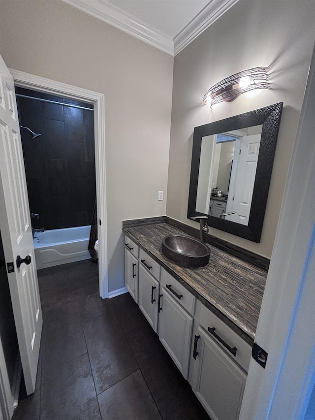 full bathroom featuring vanity, crown molding, tile patterned flooring, tiled shower / bath combo, and toilet