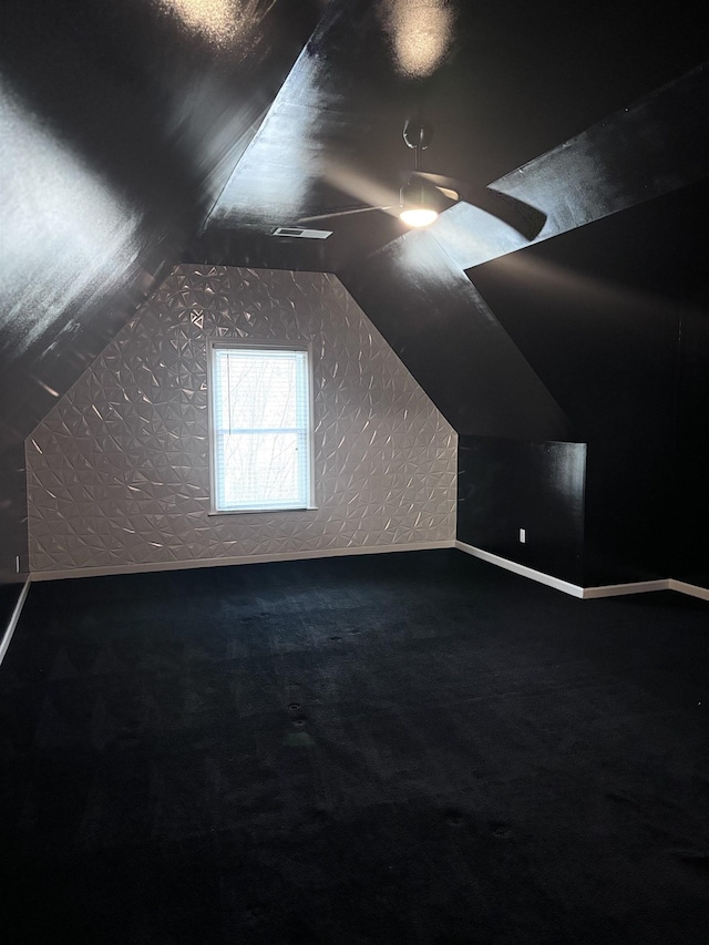 bonus room featuring carpet and vaulted ceiling