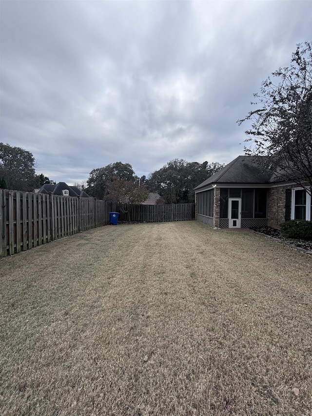 view of yard with a sunroom