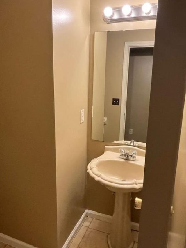 bathroom with tile patterned floors