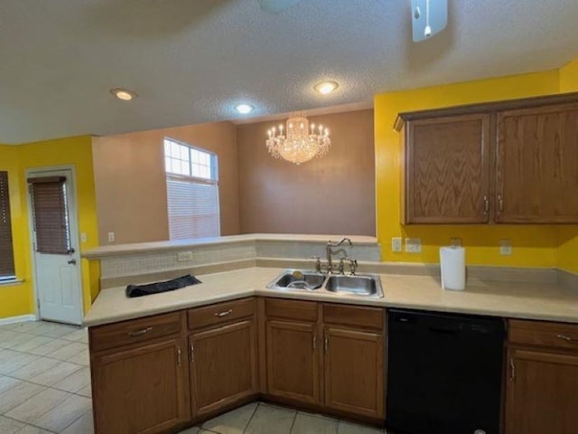 kitchen featuring kitchen peninsula, a textured ceiling, sink, a notable chandelier, and dishwasher