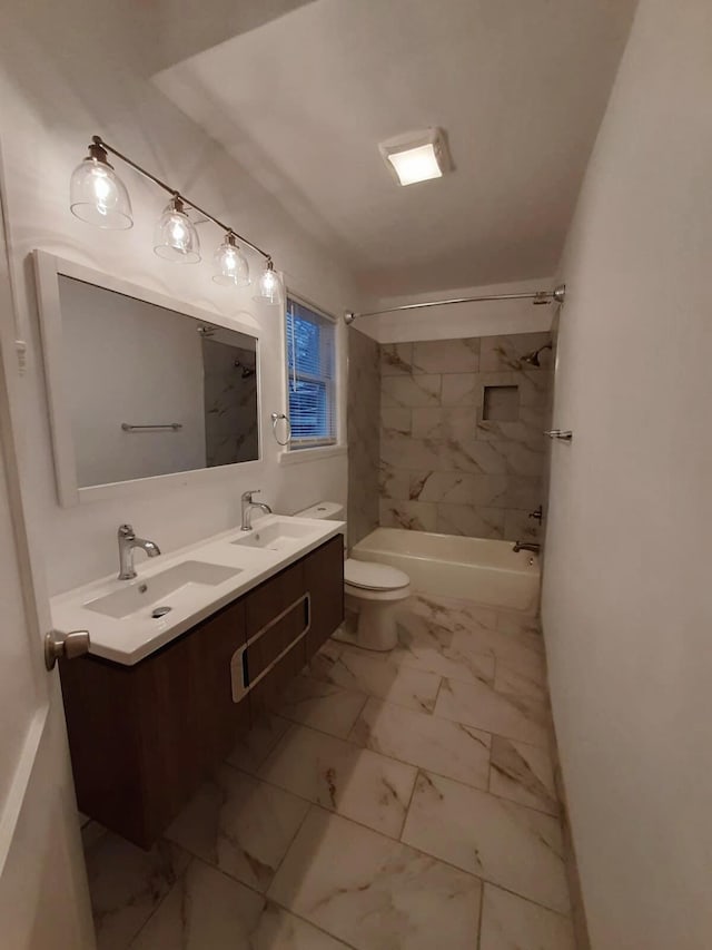 full bathroom featuring vanity, toilet, and tiled shower / bath