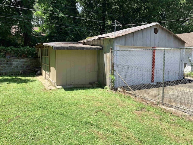 view of outbuilding featuring a lawn