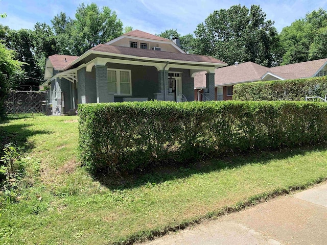 view of front of house featuring a front yard and a porch