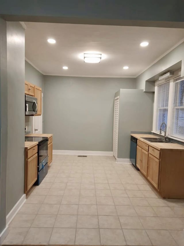 kitchen with black appliances, crown molding, light tile patterned floors, and sink