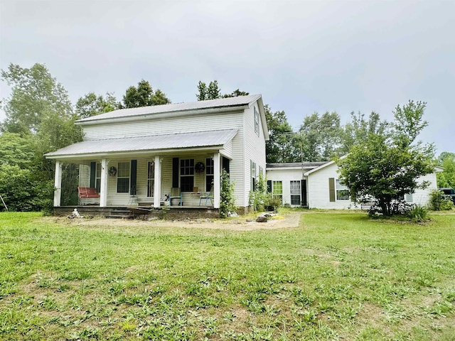 view of front facade with a porch and a front yard