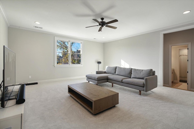 carpeted living room with ceiling fan and ornamental molding