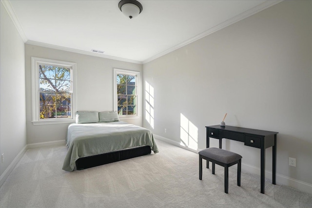 carpeted bedroom with ornamental molding