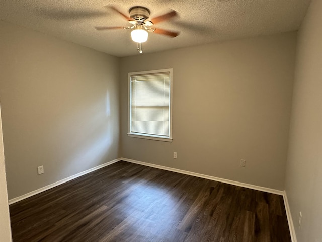 unfurnished room with a textured ceiling, dark hardwood / wood-style flooring, and ceiling fan