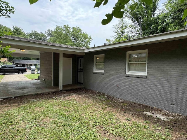 view of side of property featuring a carport