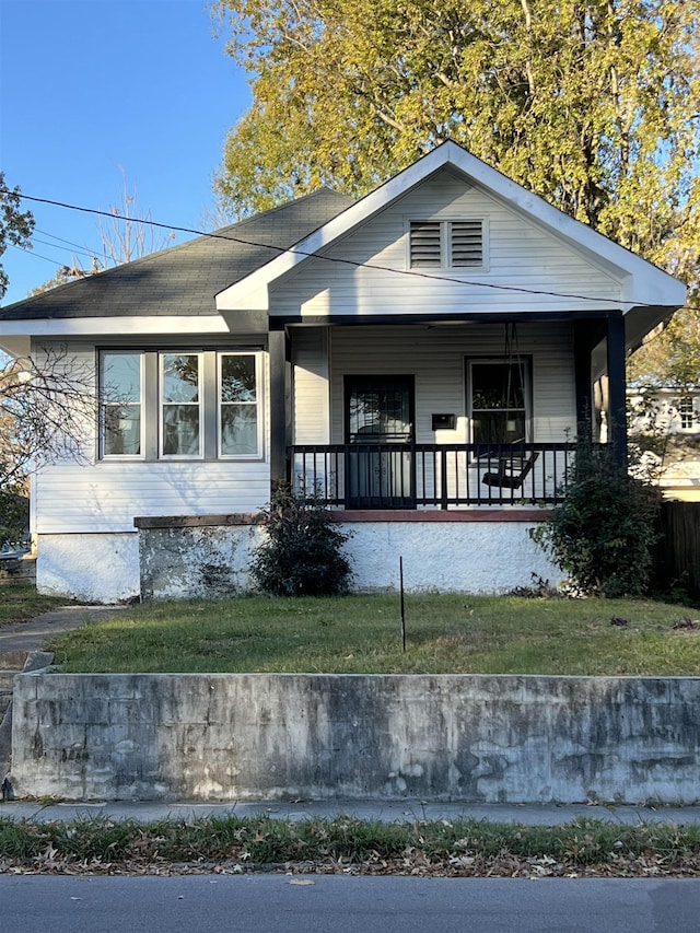 view of front facade with a porch and a front yard