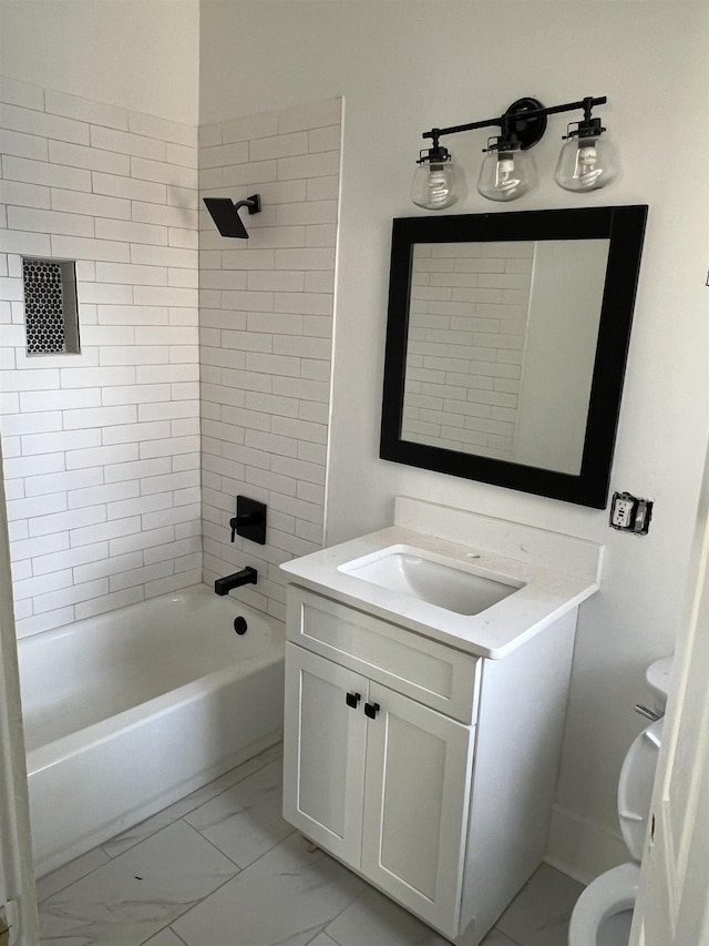 full bathroom with vanity, toilet, and tiled shower / bath