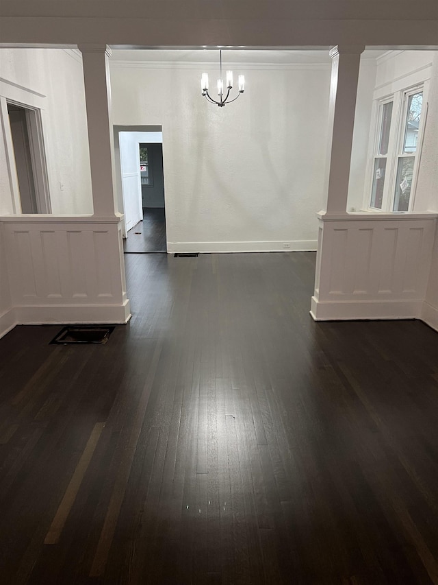 unfurnished dining area featuring dark hardwood / wood-style flooring and a notable chandelier