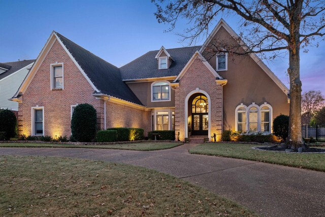 595 Kenrose St, Collierville, TN 38017 - traditional home featuring brick siding, a front yard, and a shingled roof