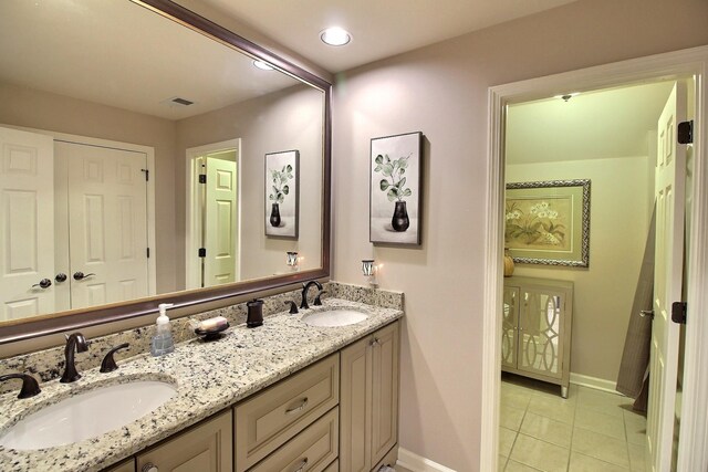 bathroom featuring tile patterned floors and vanity