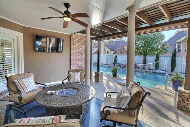 view of patio / terrace with a fenced in pool, an outdoor living space with a fire pit, and ceiling fan