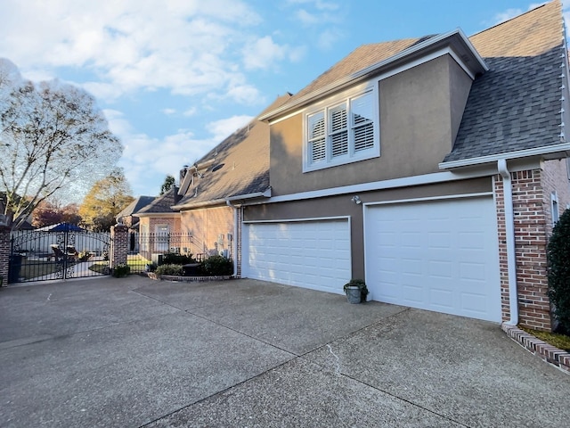 view of side of home with a garage