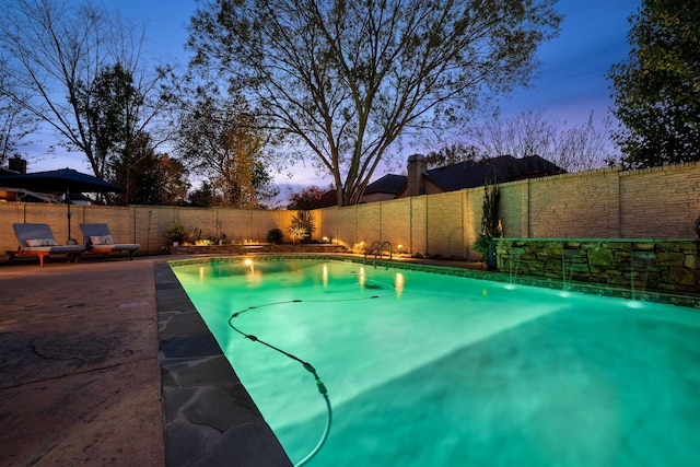 595 Kenrose St, Collierville, TN 38017 - pool at dusk featuring a fenced backyard and a patio area