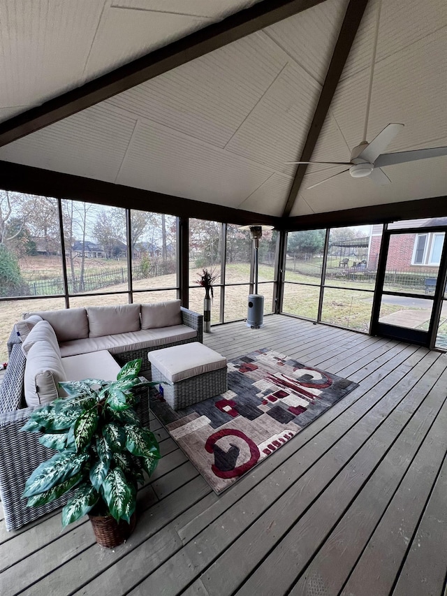 sunroom with vaulted ceiling with beams and ceiling fan