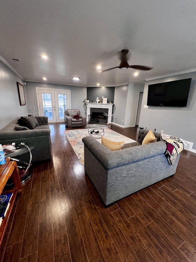 living room featuring french doors, dark hardwood / wood-style flooring, ceiling fan, and ornamental molding