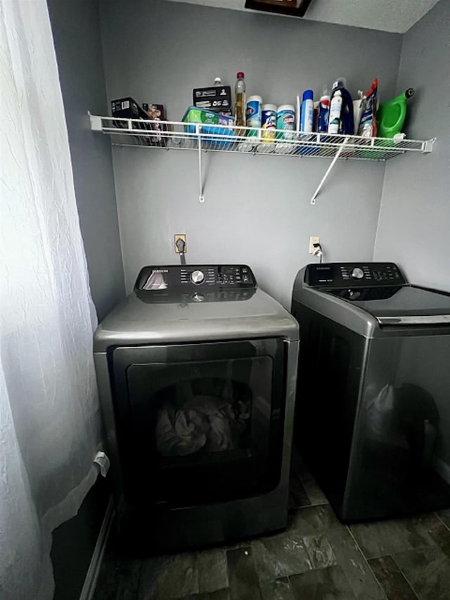 clothes washing area with independent washer and dryer