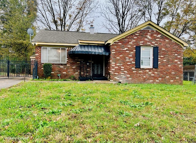 ranch-style house featuring a front lawn