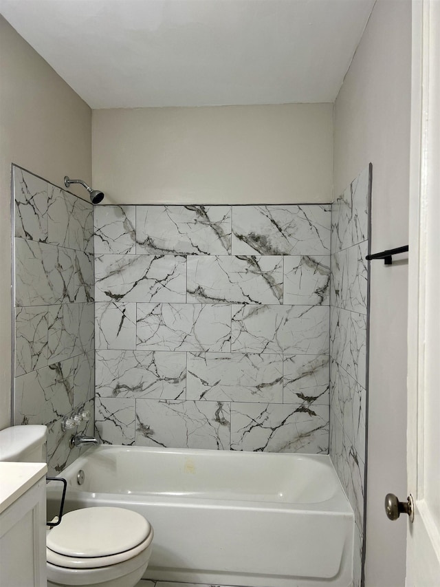 full bathroom featuring vanity, toilet, and tiled shower / bath