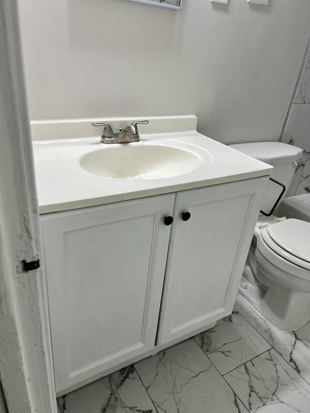 bathroom with vanity and toilet