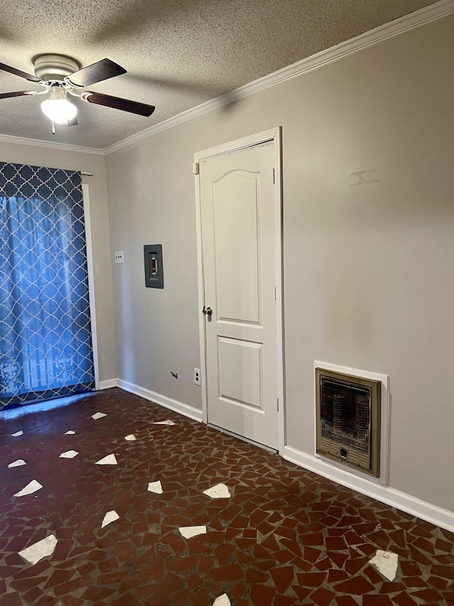 foyer entrance featuring electric panel, ceiling fan, ornamental molding, a textured ceiling, and heating unit